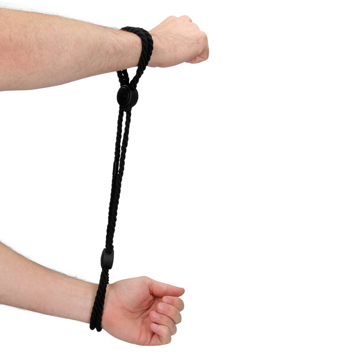 Adjustable rope handcuffs