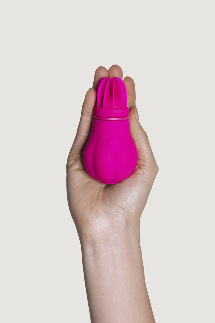 Caress vibrating rotating clitoral stimulator